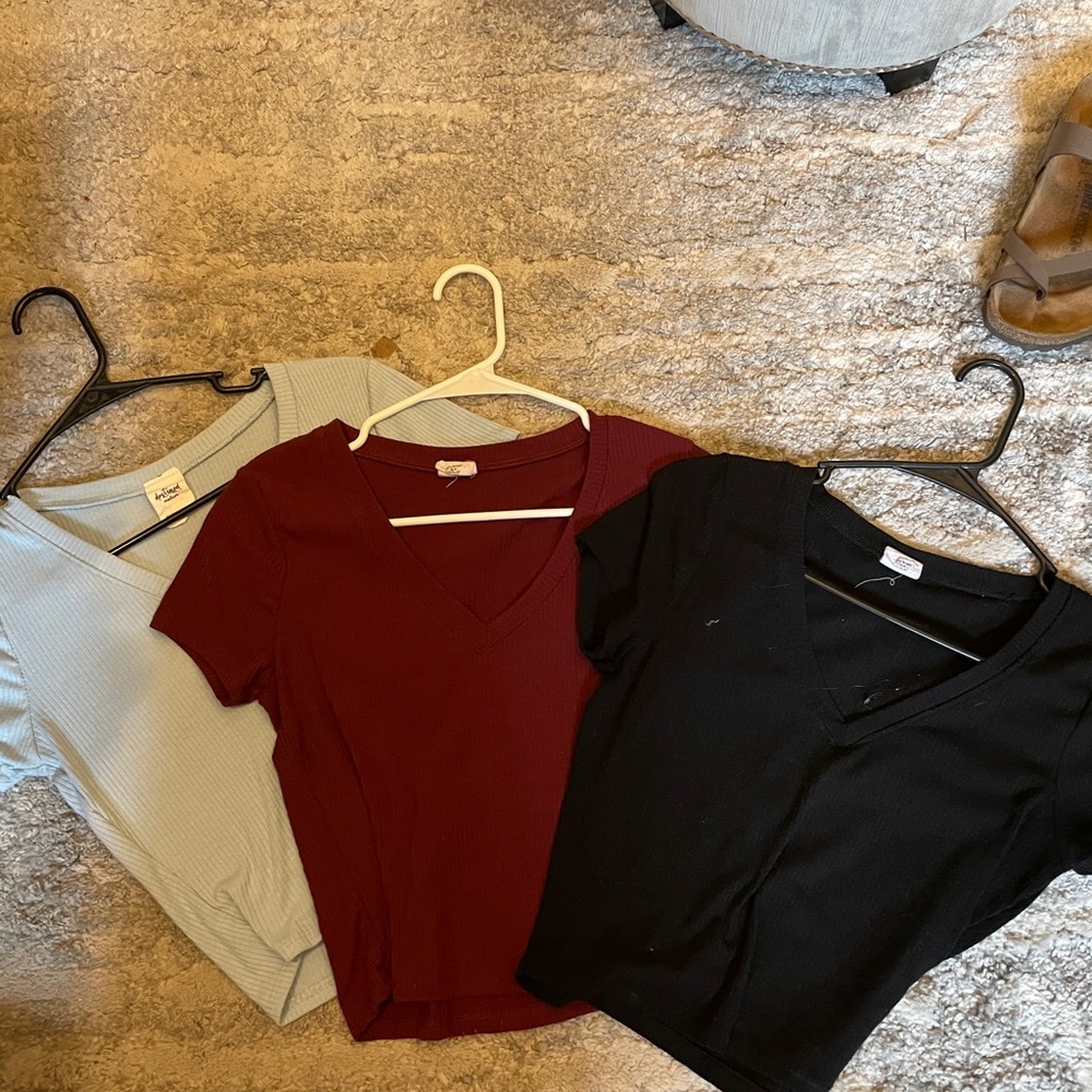 maroon black and blue V-neck shirts from Tillys